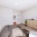 spacious bedroom with bright window
